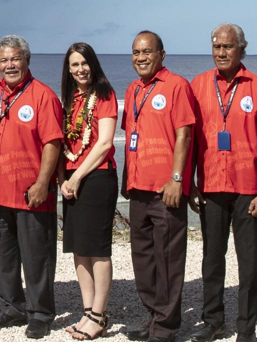 Nauru President Baron Waqa, second from left, poses with New Zealand Prime Minister Jacinda Ardern, fourth from left and other Pacific leaders for a group photo during the Pacific Islands Forum in Nauru, Wednesday, Sept. 5, 2018. (Jason Oxenham/Pool Photo via AP)