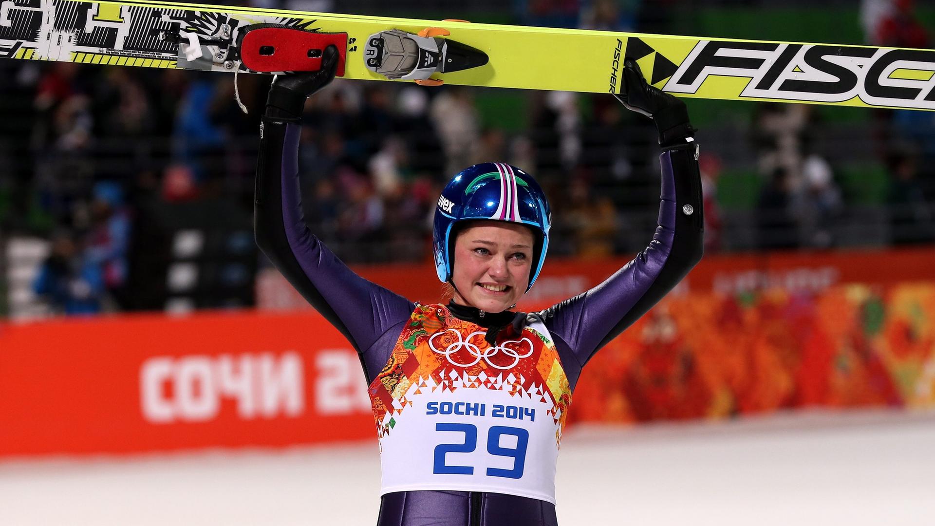 epa04070367 Gold medalist Carina Vogt of Germany reacts during the Women's Normal Hill Individual Ski Jumping competition at the Russki Gorki Jumping Centre at the Sochi 2014 Olympic Games, Krasnaya Polyana, Russia, 11 February 2014. EPA/FEHIM DEMIR