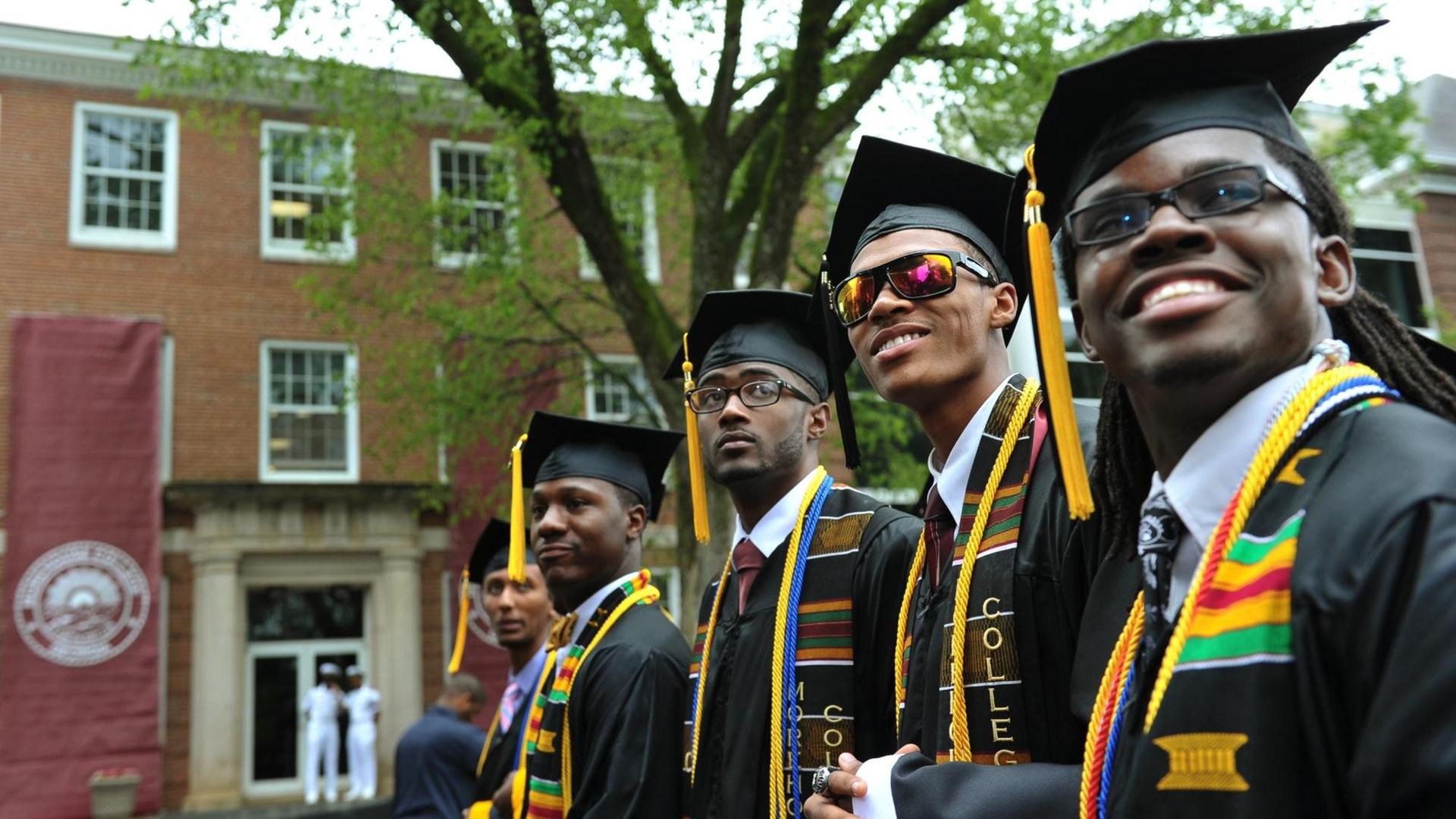Members of the graduation class of 2013 stand during the commencement ceremony before US President Barack Obama delivers the key address at Morehouse College on May 19, 2013 in Atlanta, Georgia. AFP PHOTO/Mandel NGAN / AFP PHOTO / MANDEL NGAN