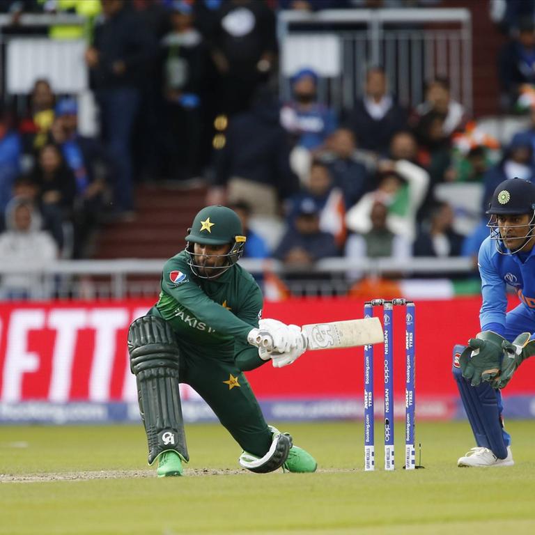 16th June 2019, Old Trafford, Manchester, England; ICC World Cup Cricket, India versus Pakistan; Fakhar Zaman of Pakistan plays a sweep shot PUBLICATIONxINxGERxSUIxAUTxHUNxSWExNORxDENxFINxONLY ActionPlus12144781 AlanxMartin  