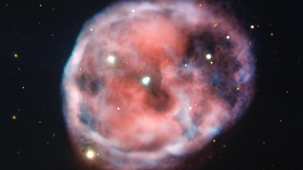This planetary nebula, also known as NGC 246, is the first known to be associated with a pair of closely bound stars orbited by a third outer star. This planetary nebula, also known as NGC 246, is the first known to be associated with a pair of closely bound stars orbited by a third outer star.