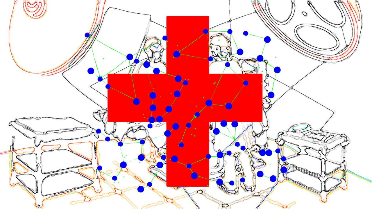 Ein rotes Kreuz und viele kleine blaue Punkte sind auf einer Grafik zu sehen. Im Hintergrund schemenhaft die Einrichtung eines Krankenhauszimmers.
