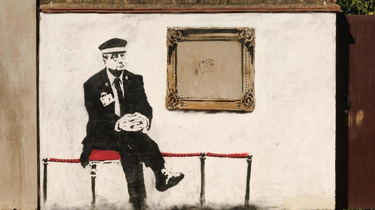 Museum guard, by the Street Artist Banksy, Martineau Road, London, N5, Britain.
