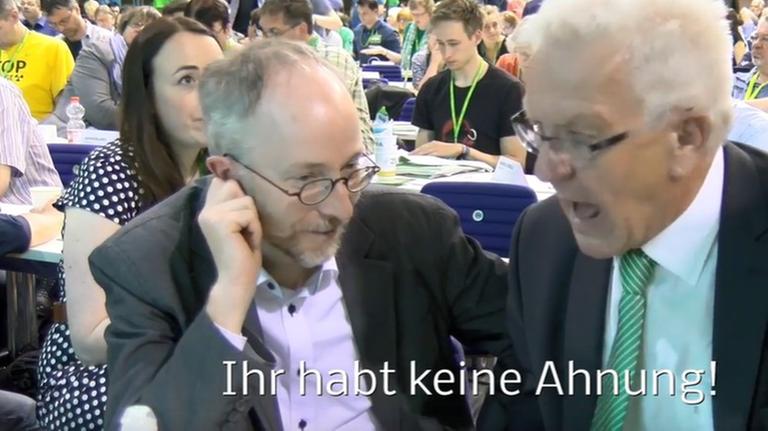 Das Bild zeigt eine Szene aus dem umstrittenen Video, in dem Baden-Württembergs Ministerpräsident Kretschmann (Grüne) dem Parteikollegen Gastel "Ihr habt keine Ahnung" zuruft (Die Untertitel stammen von den Autoren des auf Youtube veröffentlichten Beitrags).