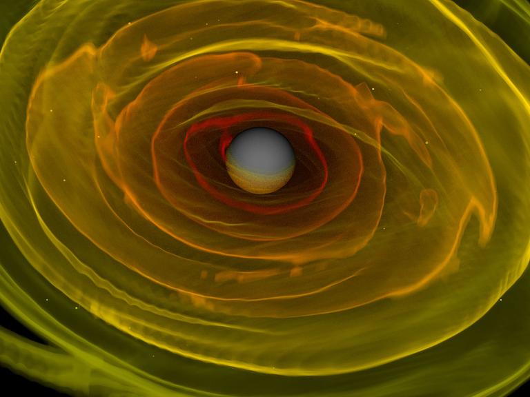 HANDOUT - Numerisch-relativistische Simulation zweier einander umkreisender und verschmelzender Neutronensterne. Dargestellt ist das bei der Verschmelzung der beiden Neutronensterne entstandene schwarze Loch und die es umgebende Aggregationsscheibe. Höhere Dichten sind rot dargestellt, geringere Dichten sind gelb dargestellt. Foto: |