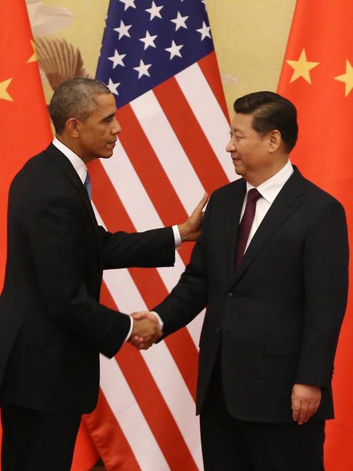 US-Präsident Obama und Chinas Staatspräsident Xi schütteln sich die Hände.