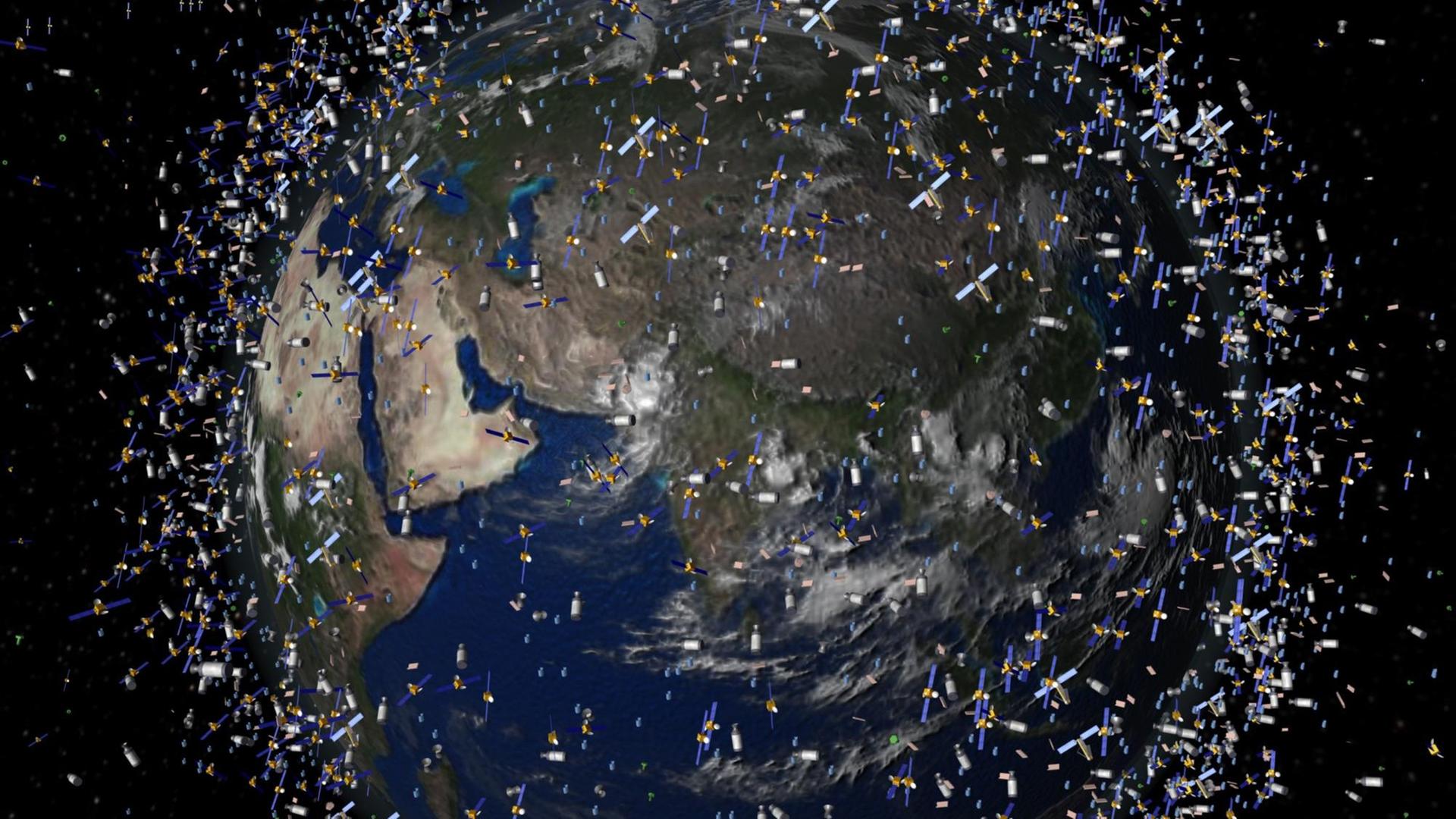 Das computergenerierte Bild zeigt Weltraummüll früherer Weltraummissionen, der neben intakten Satelliten um die Erde kreist.