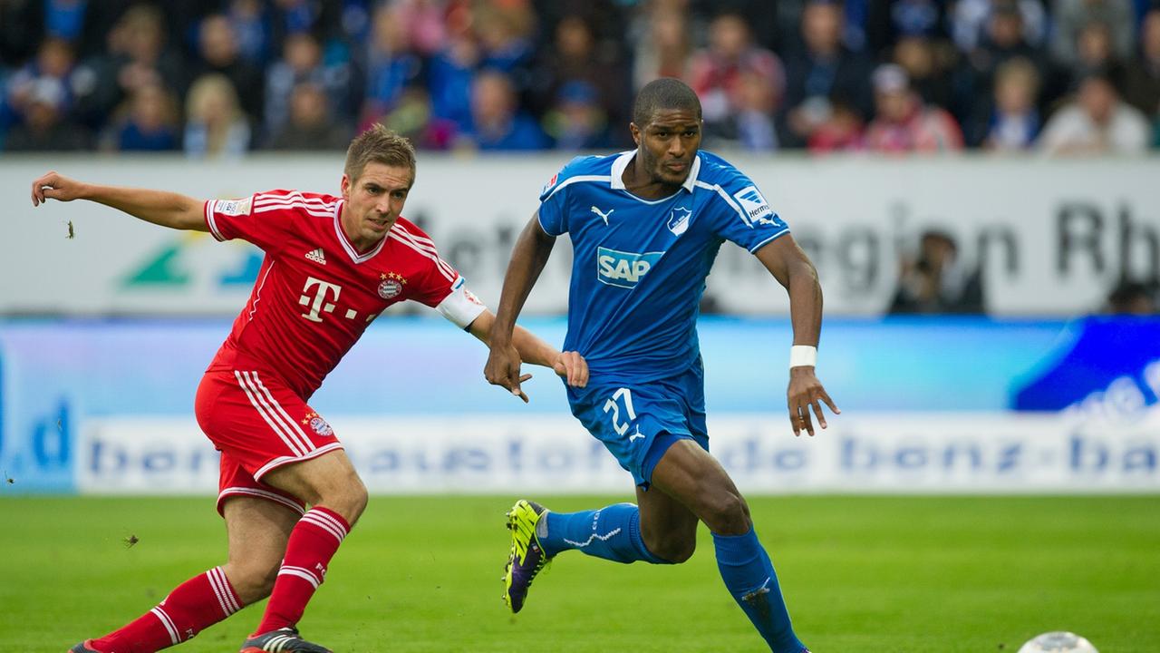 Fußball Bundesliga 11. Spieltag: TSG 1899 Hoffenheim - FC Bayern München am 02.11.2013 in Sinsheim (Baden-Württemberg) in der Rhein-Neckar-Arena. Hoffenheims Anthony Modeste (r) kämpft um den Ball mit Bayerns Philipp Lahm. Foto: Uwe Anspach/dpa (Wichtiger