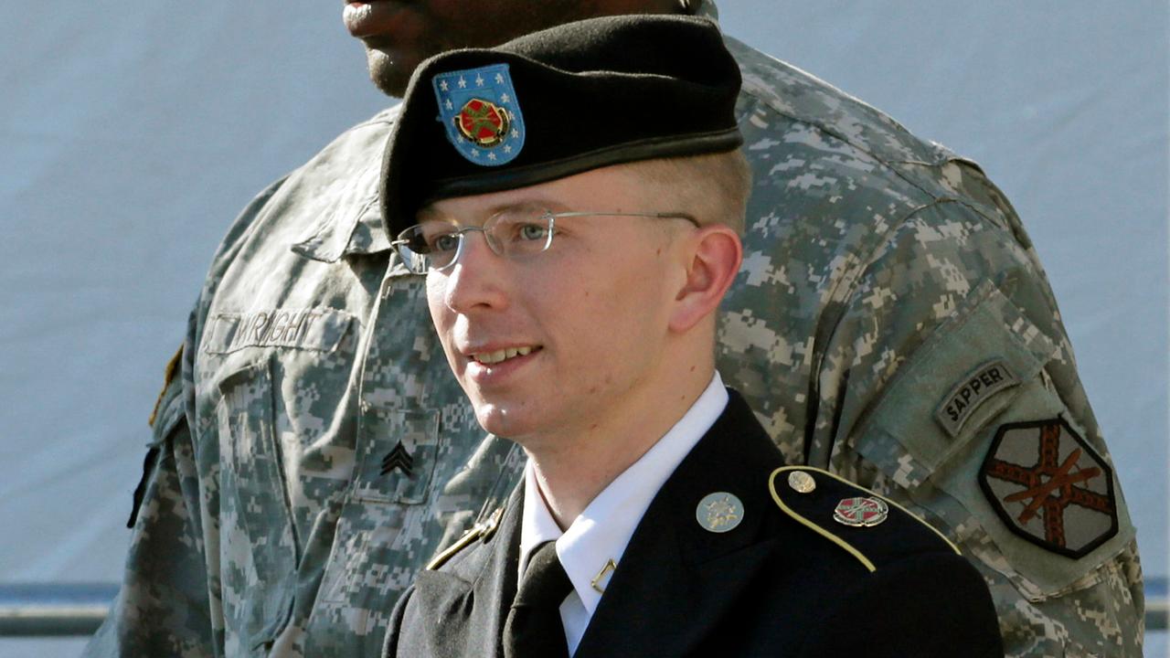 FILE - Army Pfc. Bradley Manning, right, is escorted out of a courthouse in Fort Meade, Md., Monday, June 25, 2012, after a pretrial hearing. The U.S. Army private charged with sending thousands of classified documents to the WikiLeaks secrets-sharing web