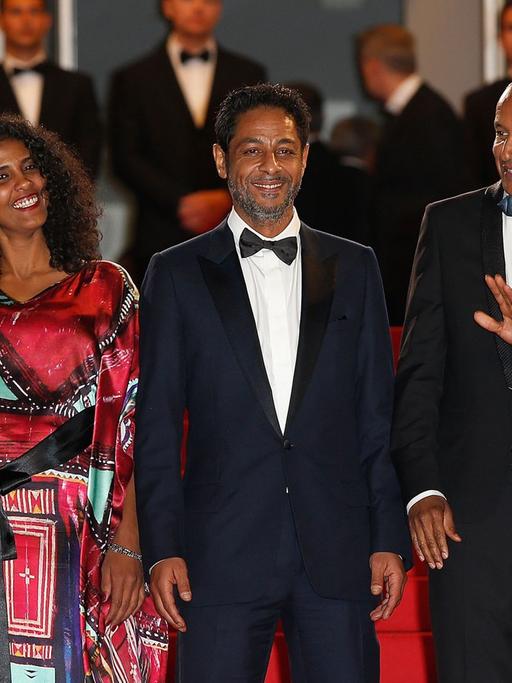 Haitian actress Kettly Noel, Niger actress Toulou Kiki, Tunisian actor Hichem Yacoubi, Mauritanian director Abderrahmane Sissako and Tunisian-born actor Abel Jafri pose as they arrives for the screening of their film "Timbuktu" at the 67th edition of the Cannes Film Festival in Cannes, southern France, on May 15, 2014.