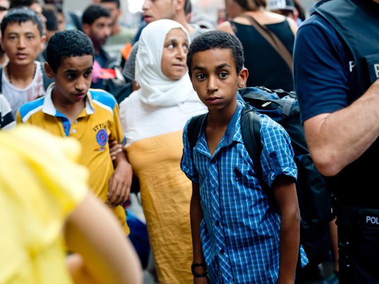 Eine syrische Familie am 1.9.2015 in München am Hauptbahnhof