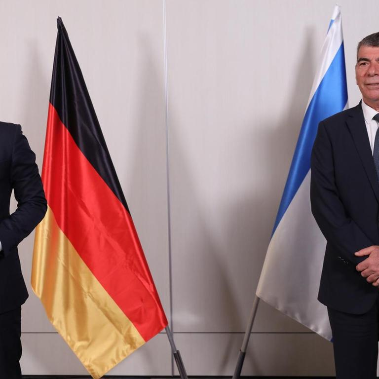 Israeli Foreign Minister Gabi Ashkenazi, right, and his German counterpart Heiko Maas attend a press conference at the Ben Gurion Airport near Tel Aviv, Israel Thursday, May 20, 2021. (Abir Sultan/Pool Photo via AP)