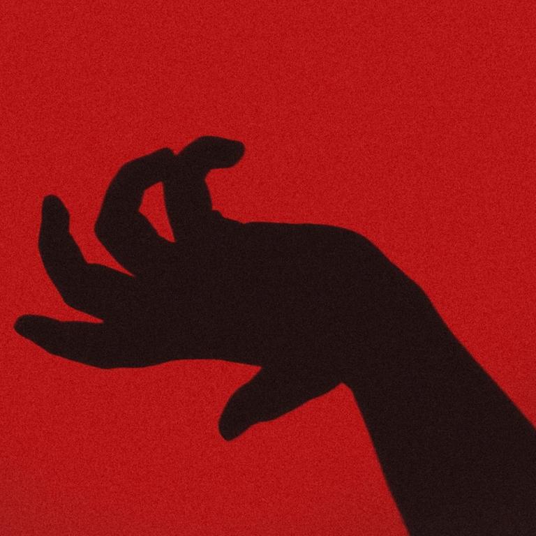 Die Silhouette einer Hand vor einem roten Hintergrund
