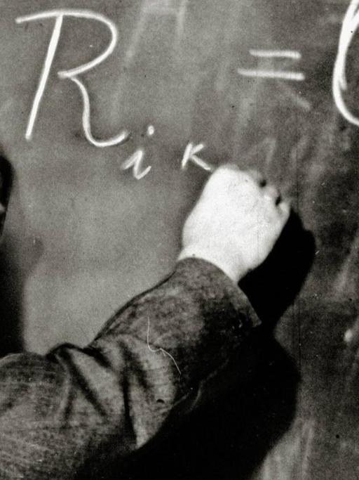 German-born theoretical physicist Albert Einstein writes out an equation for the density of the Milky Way on the blackboard at the Carnegie Institute, Mt. Wilson Observatory headquarters in Pasadena, CA, January 14, 1931.