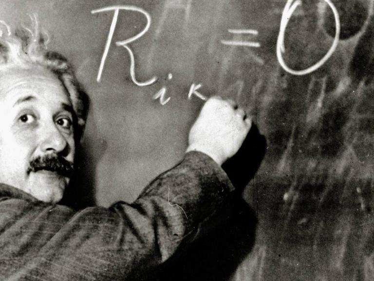German-born theoretical physicist Albert Einstein writes out an equation for the density of the Milky Way on the blackboard at the Carnegie Institute, Mt. Wilson Observatory headquarters in Pasadena, CA, January 14, 1931.