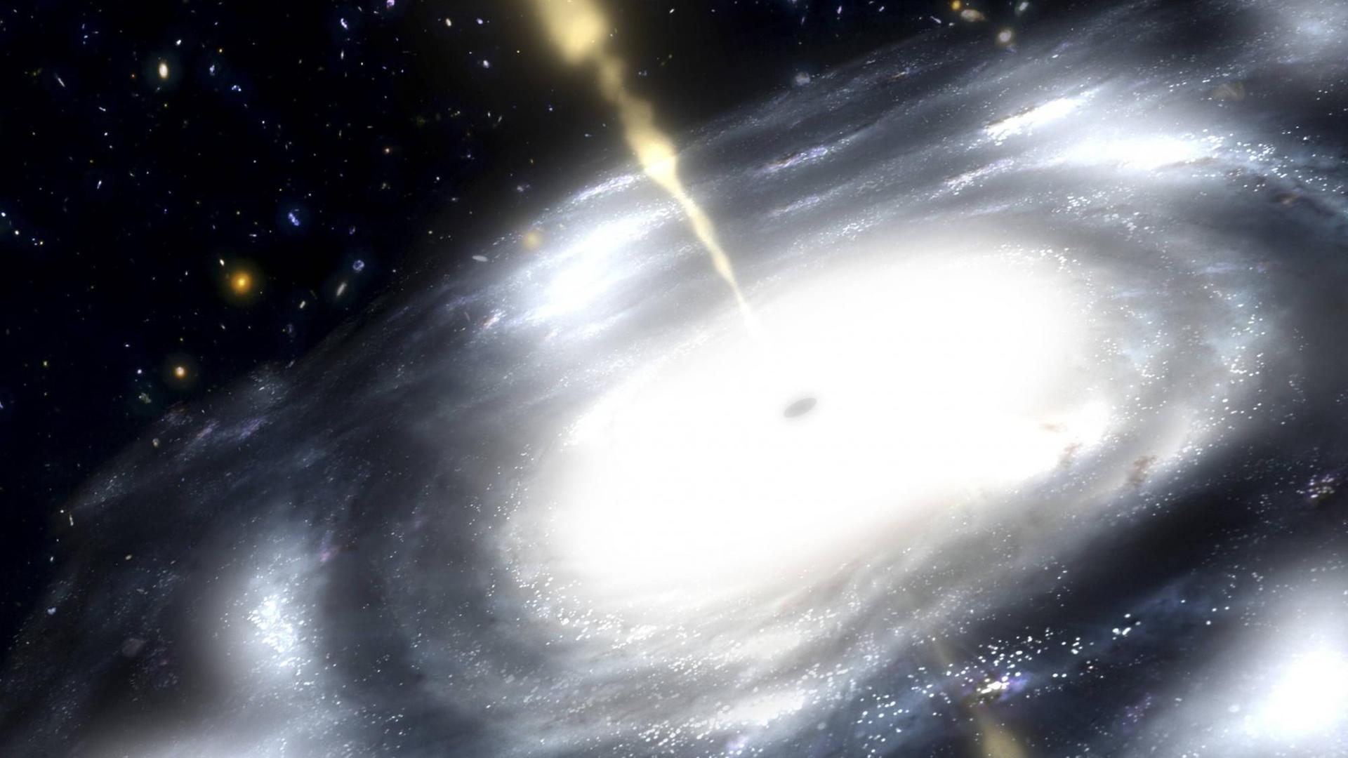 Künstlerische Darstellung einer seltenen Galaxie, die Radiopulse ausstrahlt. (This artist s rendition illustrates a rare galaxy that is extremely dusty and produces radio jets)