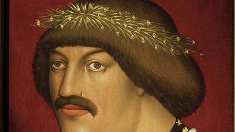 Ein Ölgemälde zeigt den österreichischen Herzog Albrecht V. in rotem, gold besetzten Gewand mit Schnurbart und vergoldetem Lorbeerkranz auf dem Kopf Albrecht V.., ab 1404 Herzog von Österreich- ab zehn 1438 als Albrecht II. Römisch-Deutscher König;