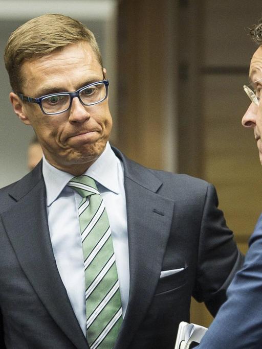 Pierre Moscovici, Alexander Stubb,und Jeroen Dijsselbloem