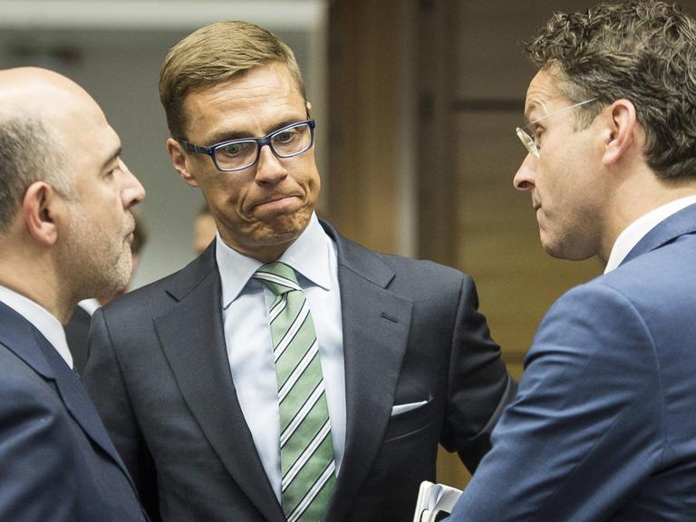 Pierre Moscovici, Alexander Stubb,und Jeroen Dijsselbloem