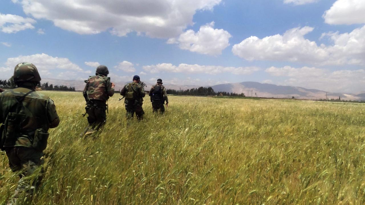 epa03699241 A handout photo made available on 13 May 2013 by the official Syrian Arab News Agency (SANA) is said to show Syrian army soldiers taking position during a patrol in the Jarba area in rural Damascus, Syria. According to media reports the Syrian epa03699241 A handout photo made available on 13 May 2013 by the official Syrian Arab News Agency (SANA) is said to show Syrian army soldiers taking position during a patrol in the Jarba area in rural Damascus, Syria. According to media reports the Syrian