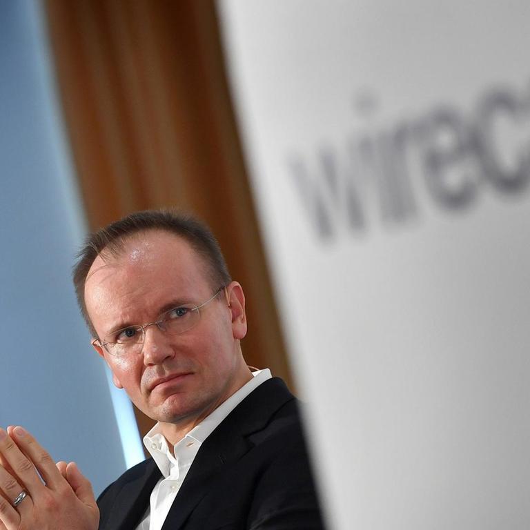 Ex-Wirecard-Vorstandsvorsitzender Markus Braun und das Logo des Unternehmens 