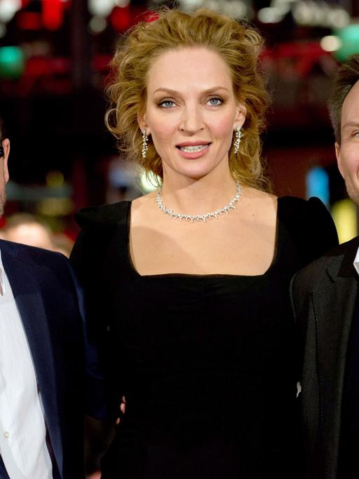 Regisseur Lars von Trier (l-r), Uma Thurman und Christian Slater kommen am 09.02.2014 in Berlin während der 64. Internationalen Filmfestspiele zur Premiere des Films "Nymphomaniac Volume eins. Der Film lief im Wettbewerb der Festspiele.