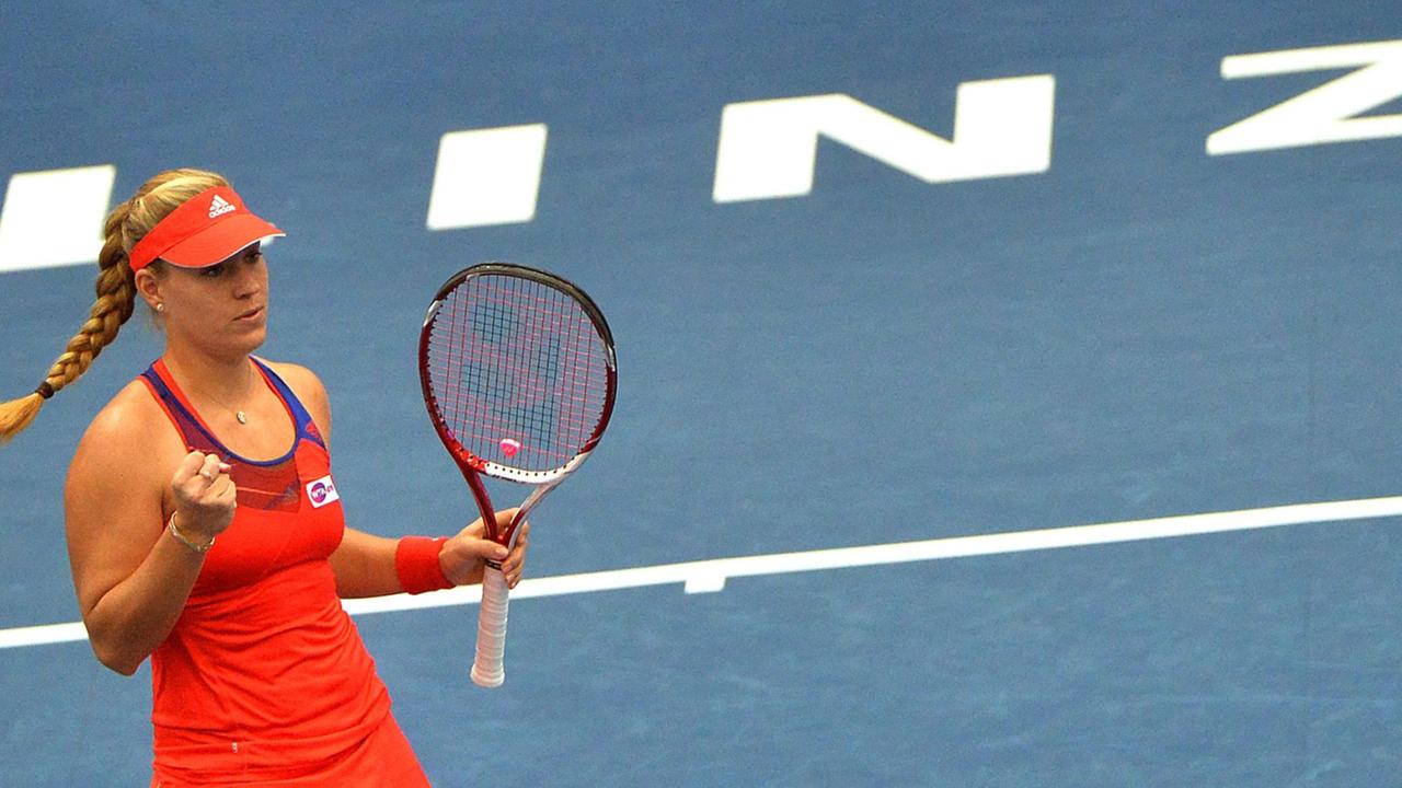 epa03907193 Angelique Kerber of Germany celebrates after winning a point against Carla Suarez Navarro of Spain during their semi final match at the WTA Generali Ladies Tennis tournament in Linz, Austria, 12 October 2013. Kerber won 6-2 and 6-0. EPA/BARBAR epa03907193 Angelique Kerber of Germany celebrates after winning a point against Carla Suarez Navarro of Spain during their semi final match at the WTA Generali Ladies Tennis tournament in Linz, Austria, 12 October 2013. Kerber won 6-2 and 6-0. EPA/BARBAR