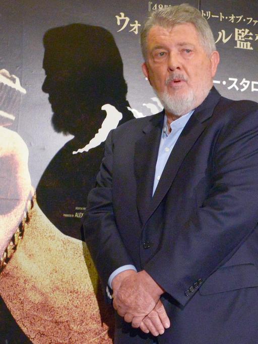 U.S. director Walter Hill poses for photographers during a press conference to promote his first movie in 10 years, "Bullet to the Head", in Tokyo, April 22, 2013. He said that he wants to shoot more films and hopes to come back to Japan with his new work.