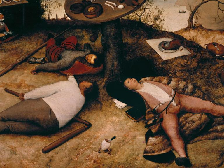 Auf dem Gemälde "Das Schlaraffenland von Pieter Bruegel d.Ae. liegen erschöpfte Menschen nach einer Völlerei auf dem Boden.