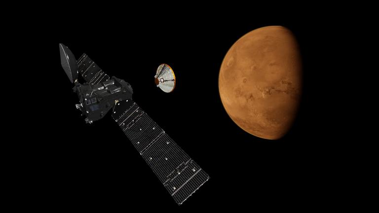 Der ExoMars Trace Gas Orbiter und die Landekapsel Schiaparelli beim Anflug auf den Mars (Zeichnung).