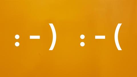 Emojis: freundlich und unfreundlich.