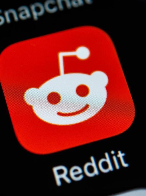 Das Bild zeigt das Icon der App "Reddit", ein Gesicht mit einer Antenne auf dem Kopf.