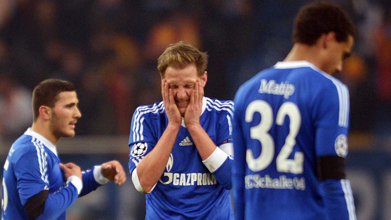 Schalke's Benedikt Höwedes (C) reacts after loosing the UEFA Champions League round of 16 second leg soccer match between FC Schalke 04 and Galatasaray Istanbul at Stadion Gelsenkirchen, Gelsenkirchen, Germany, 12 March 2013. Photo: Federico Gambarini/dpa