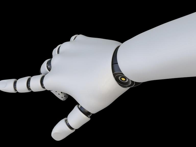 Eine weiße Roboterhand hat ihren Zeigefinger ausgestreckt.