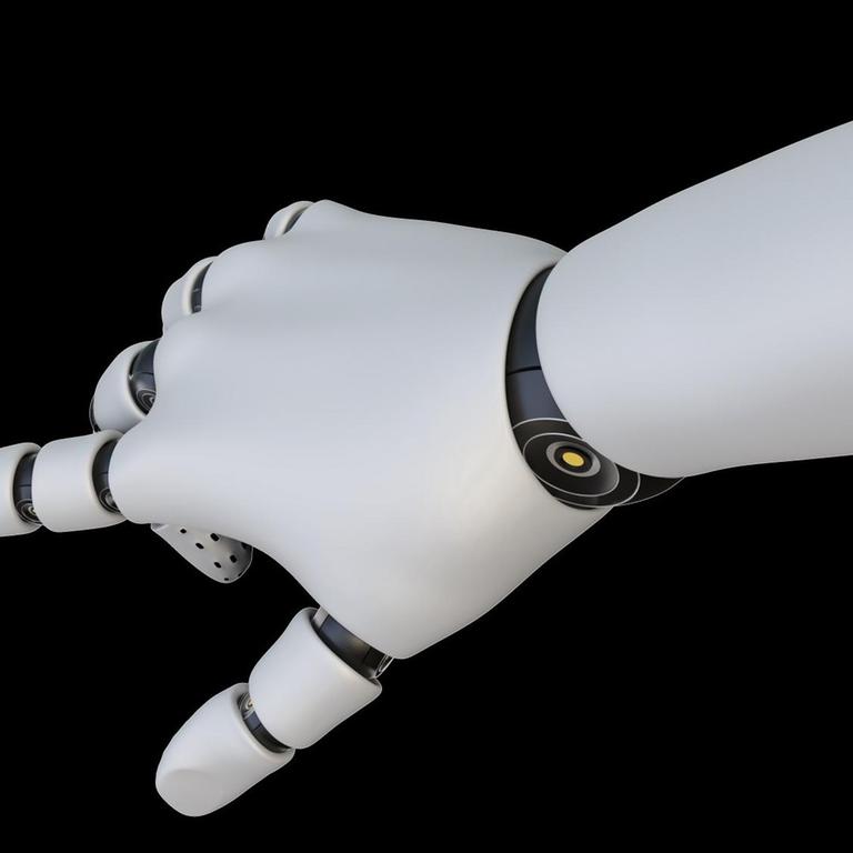 Eine weiße Roboterhand hat ihren Zeigefinger ausgestreckt.