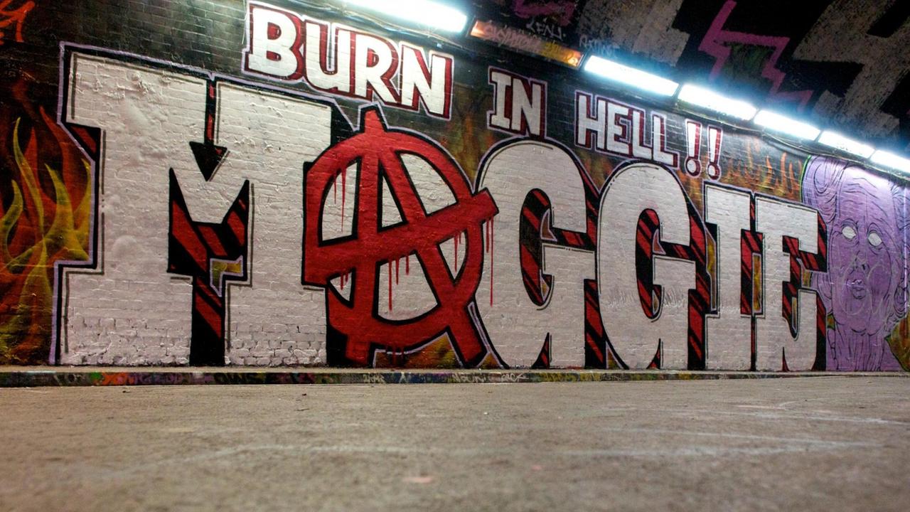 Ein Anarcho-Wandbild in London wünscht Margaret Thatcher zur Hölle (Burn in Hell, Maggie!, wobei das 'A' als Anarchiezeichen gesetzt ist.) - stellvertretend für den Neoliberalismus?