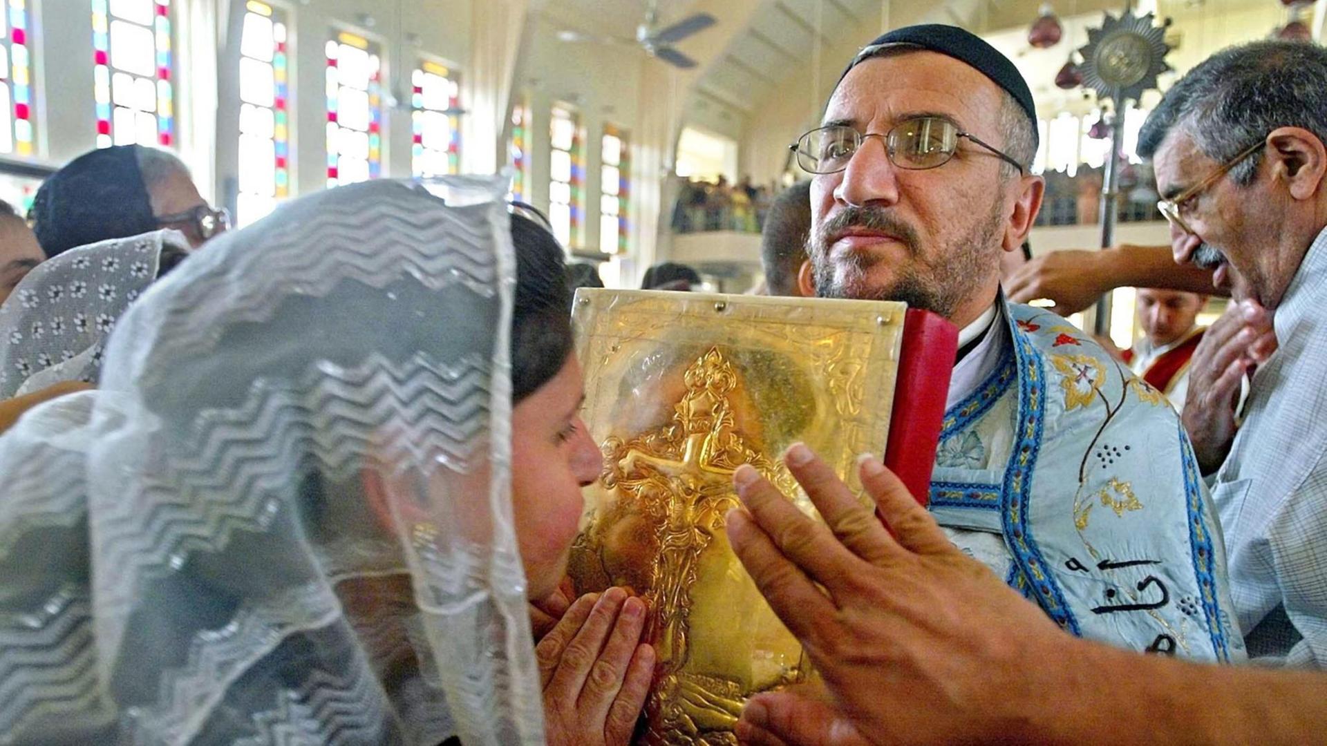 Orthodoxe Christen aus dem Irak feiern Ostern