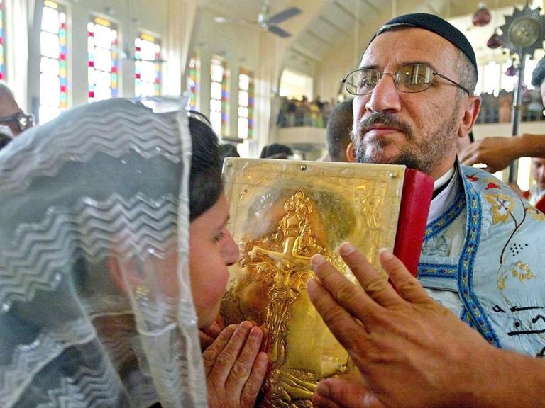 Orthodoxe Christen aus dem Irak feiern Ostern