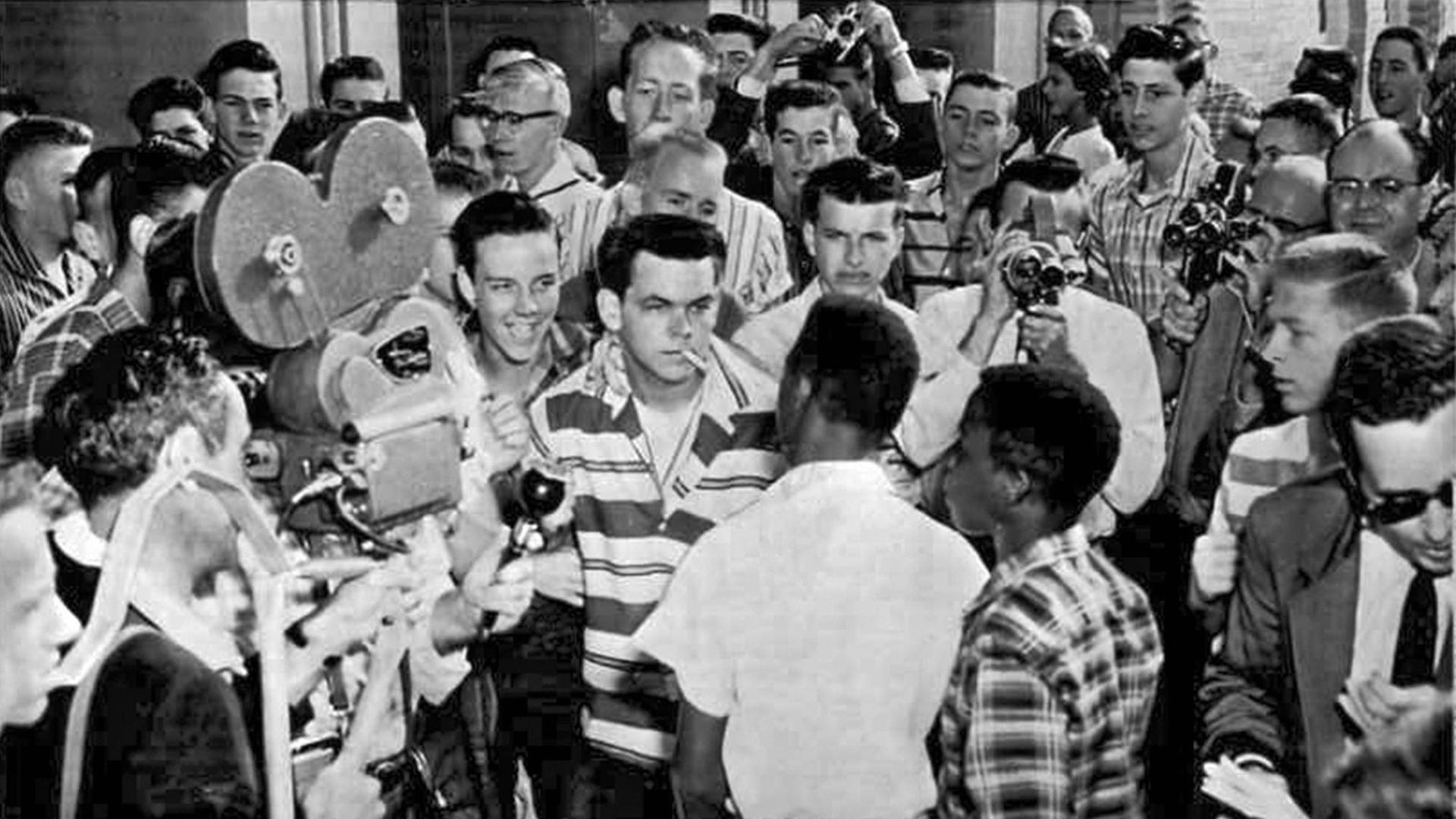 Little Rock, Arkansas: September 9, 1957. Students at the North Little Rock HIgh School blocked the doors of the school to prevent six Negro students who had been enrolled earlier at the school from entering. The picture shows a white student daring a Negro to try and enter. Just after this picture was taken, the Negroes were shoved down a flight of stairs and out to the sidewalk. PUBLICATIONxINxGERxSUIxAUTxHUNxONLY 990_16_7-HIst-CR_1HR Little Rock Arkansas September 9 1957 Students AT The North Little Rock High School blocked The Doors of The School to Prevent Six Negro Students Who had been earlier AT The School from ENTERING The Picture Shows a White Student Daring a Negro to Try and Enter Just After This Picture what Taken The Were Down a Flight of Stairs and out to The Sidewalk PUBLICATIONxINxGERxSUIxAUTxHUNxONLY 990_16_7 CR_1HR