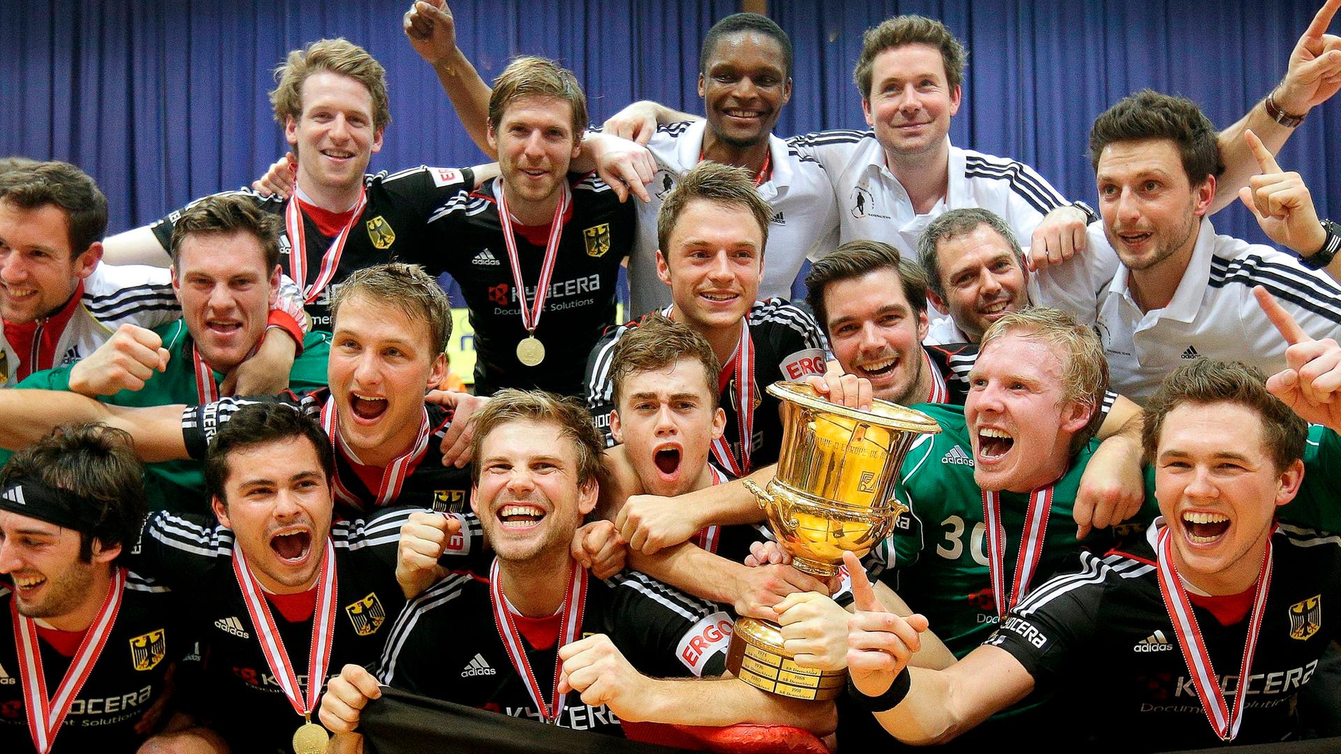 epa04030861 Players of the German Team celebrate with the trophy after winning the European Indoor Hockey Championship final between Austria and Germany in Vienna, Austria, 19 January 2014. EPA/GEORG HOCHMUTH epa04030861 Players of the German Team celebrate with the trophy after winning the European Indoor Hockey Championship final between Austria and Germany in Vienna, Austria, 19 January 2014. EPA/GEORG HOCHMUTH