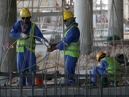Migranten auf einer Baustelle in Katar
