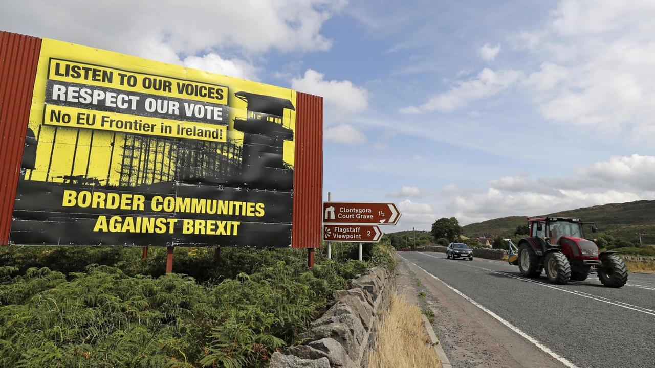 Anti Brexit billboards are seen on the northern side of the border between Newry, in Northern Ireland, and Dundalk, in the Republic of Ireland, on Wednesday, July 18, 2018. British Prime Minister Theresa May is scheduled to make her first visit to the Irish border since the Brexit referendum later this week. (Niall Carson/PA via AP)