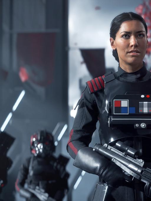 Screenshot aus Star Wars Battlefront 2 - eine imperiale Soldatin steht mit ihren unbehelmten Kollegen in Bereitschaft