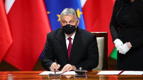 Prime Minister of Hungary Viktor Orban (L) during the signing of the Anniversary Declaration and the Digital Declaration in Krakow, south Poland 2021. A summit of the heads of governments of the Visegrad Group countries is held in Krakow with the participation of the President of the European Council on the occasion of the 30th anniversary of Visegrad Cooperation. On July 1 last year, Poland's annual presidency in the V4 began. PAP/LUKASZ GAGULSKI POLAND OUT