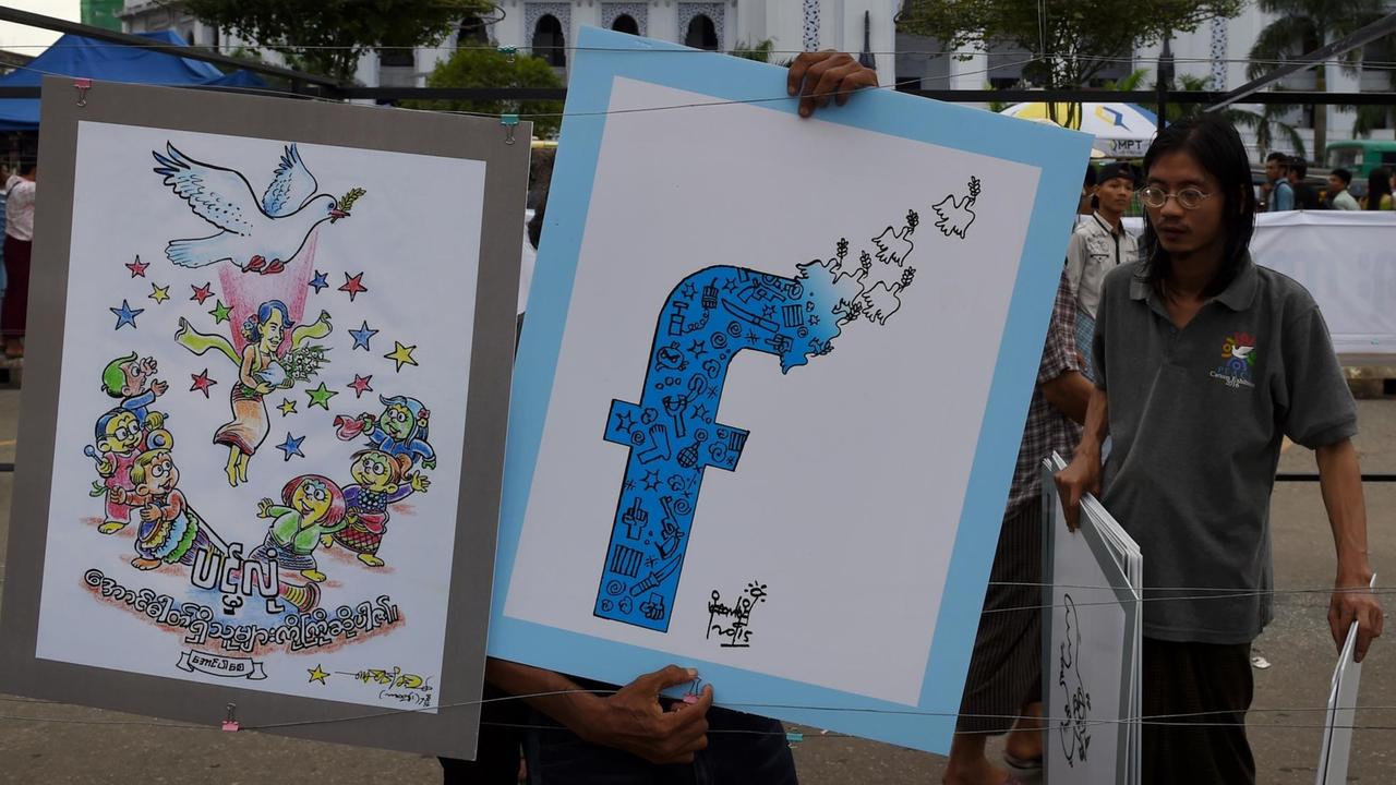Politische Cartoons, inspiriert vom Facebook-Logo (R) des myanmarischen Cartoonisten Kyaw Tin Myint Thit und einer der myanmarischen Demokratie-Ikone Aung San Suu Kyi mit einer von Moe Htet Moe geschaffenen Friedenstaube (L).