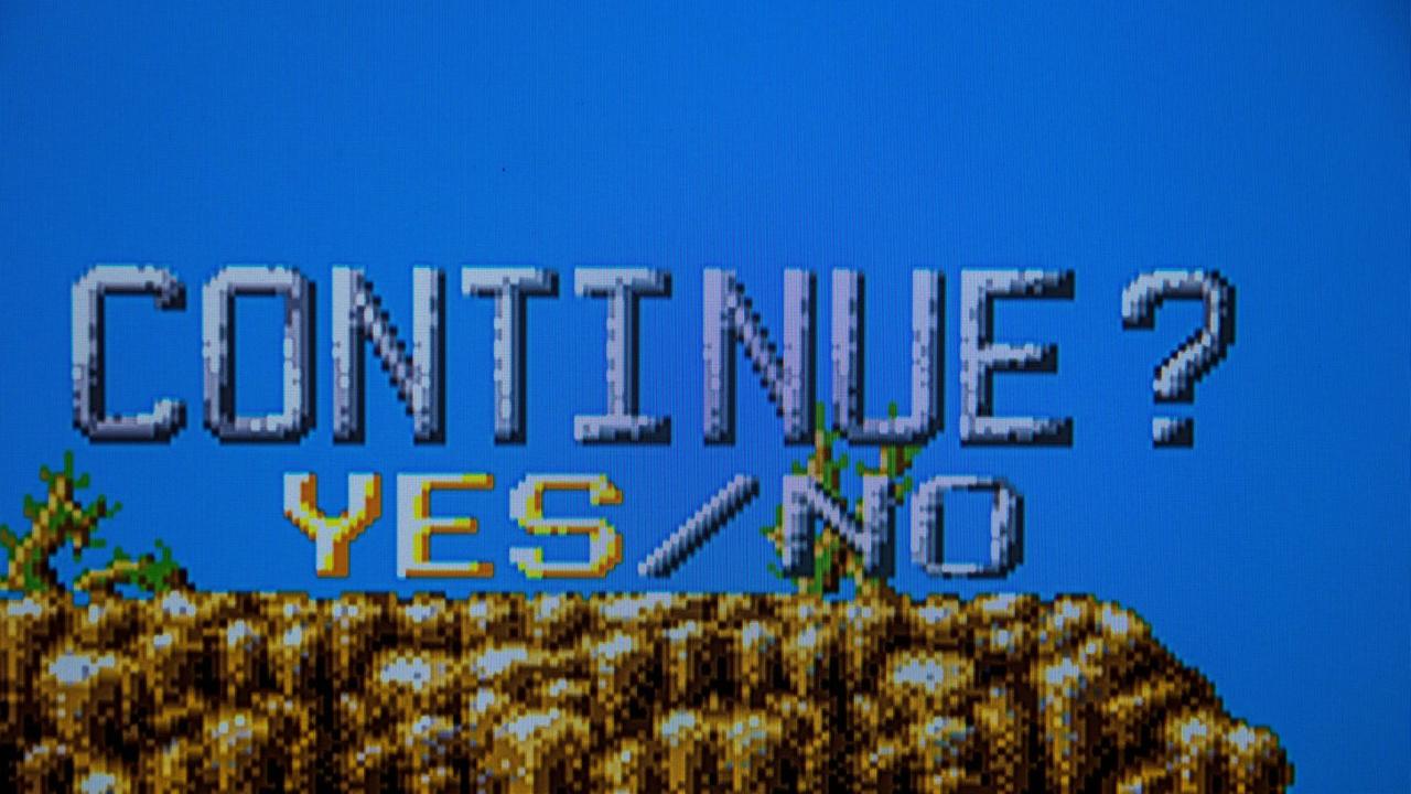 Klassisches Videospiel in Pixelgrafik fragt, ob man weiterspielen möchte: Continue Yes No.