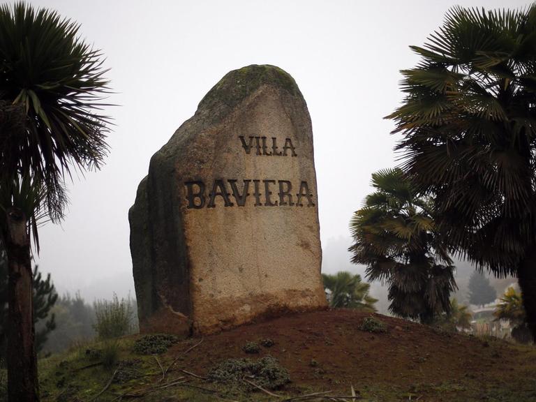 epa05417828 A picture available on 09 July 2016 shows a marked stone in the Villa Baviera, formerly known as Colonia Dignidad, in Chile, 15 June 2016. The Colonia Dignidad was founded by German Paul Schaefer, 400 kilometers south of Santiago, in 1961. The agricultural commune was formed by German people fleeing from their devastated country after the second World War. During the Chilean dictatorship, the location was used for interrogation and torture of opposition members to the Augusto Pinochet regime. Schaefer fled Colonia Dignidad on 20 May 1997 after being sought by Chilean authorities on child abuse charges, for which he was found guilty in his absence, was later extradited from Argentina in 2005, and died in prison in 2010. In 2007 Colonia Dignidad became a touristic location and was renamed Villa Baviera. EPA/MARIO RUIZ |