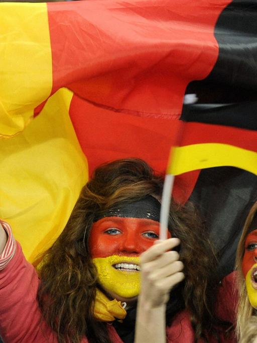 Germany supporters cheer during a World Cup semifinal against Spain at Durban Stadium in Durban, South Africa, on July 7, 2010. Spain won 1-0.