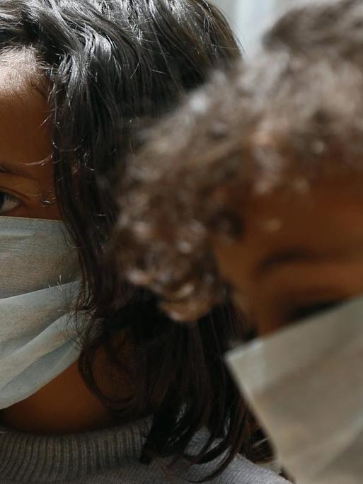 Children wearing masks are seen in Sanaa, Yemen, March 15, 2020. YEMEN-SANAA-COVID-19 nieyunpeng
