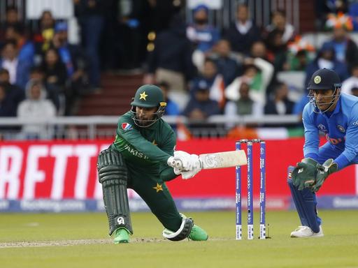16th June 2019, Old Trafford, Manchester, England; ICC World Cup Cricket, India versus Pakistan; Fakhar Zaman of Pakistan plays a sweep shot PUBLICATIONxINxGERxSUIxAUTxHUNxSWExNORxDENxFINxONLY ActionPlus12144781 AlanxMartin